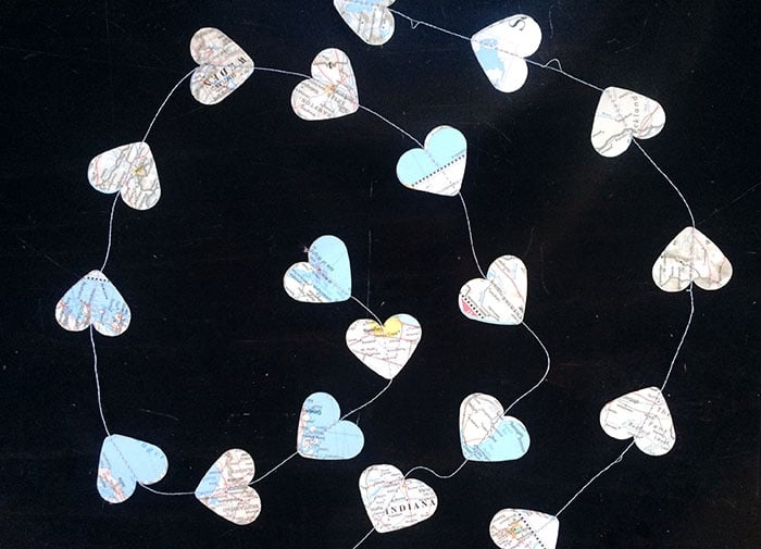 Easy DIY Garland sewing heart cut-outs in a strand