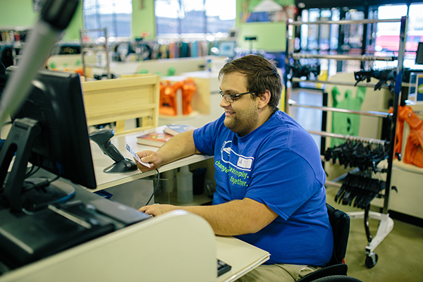 Goodwill disability services modified the cash register station to fit Matt's need