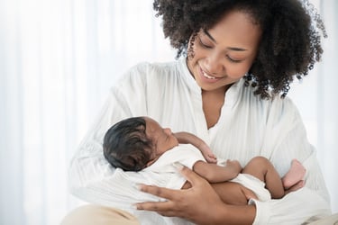 breast feeding blog woman-holding-newborn-baby-in-white-clothing-2026-03-25-07-30-07-utc